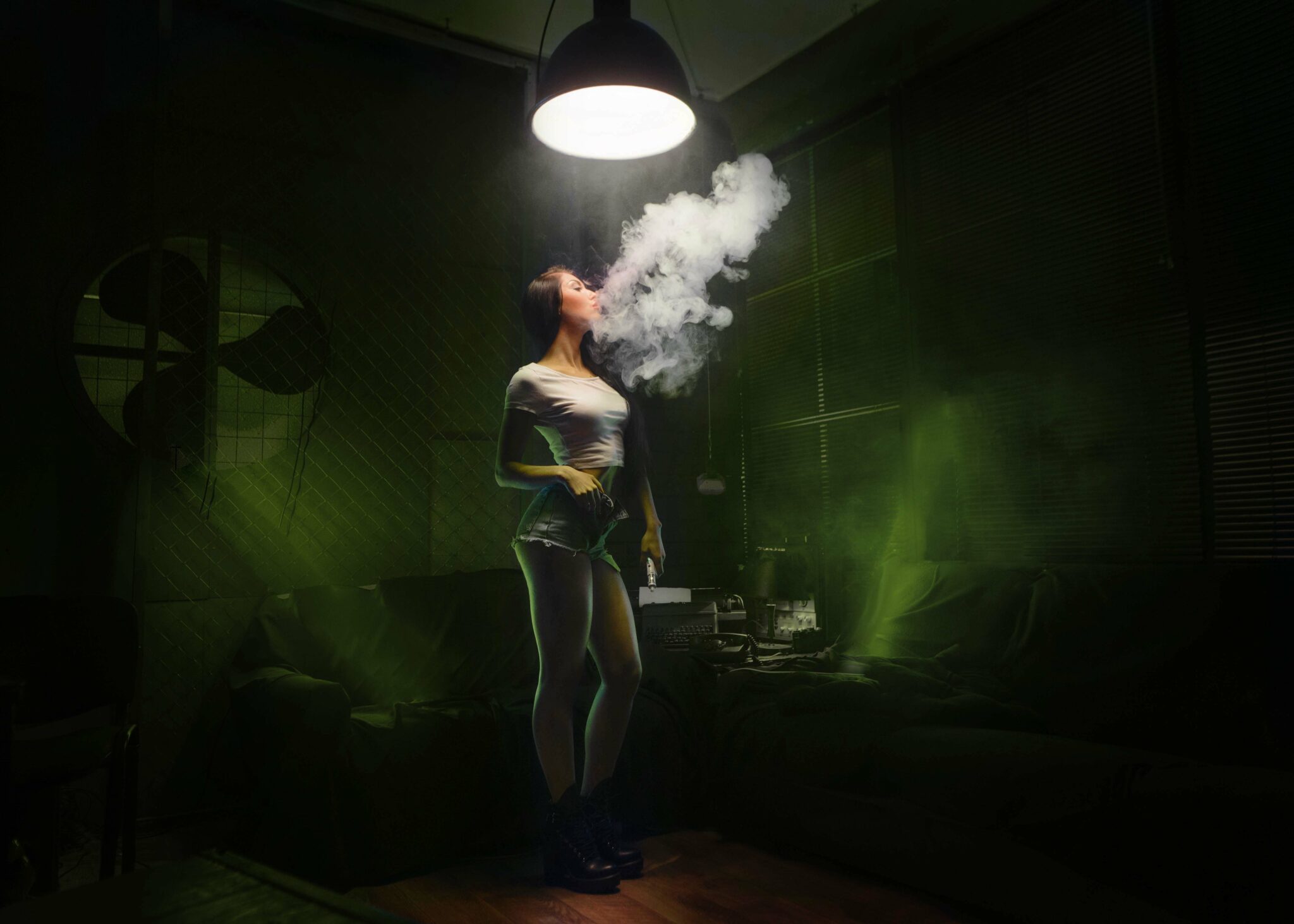 sexy brunette woman smoking electronic cigarette